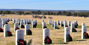 Bryan Correira | Herald Volunteers walk across the field at the Central Texas State Veterans Cemetery on Sunday, Jan. 5, 2014. More than 5,000 wreaths were to be removed.